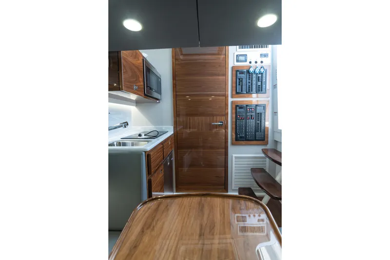 Slide: The Image of Luxurious interior of 2025 Valhalla Boatworks V-46, featuring modern kitchen and control panels. - 31
