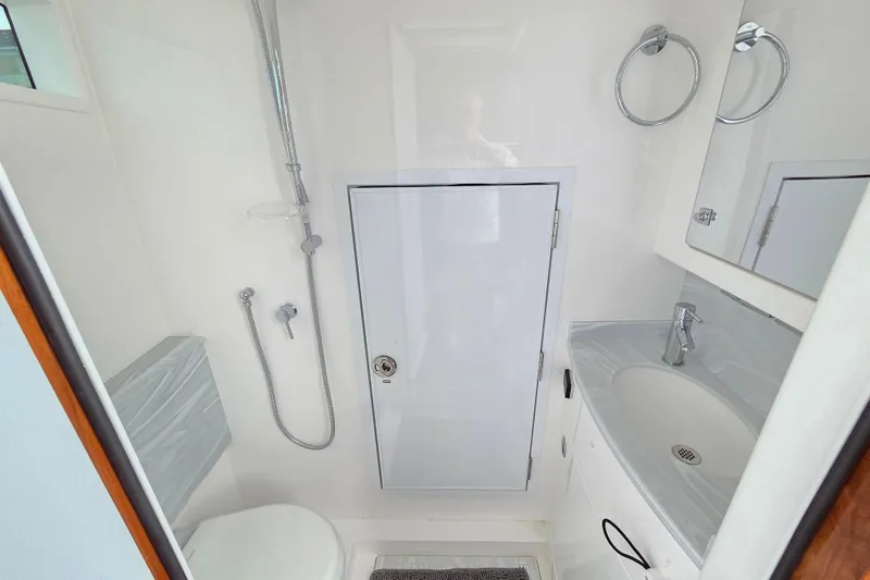 Slide: The Image of 2025 Valhalla Boatworks V-46 bathroom with shower, sink, and modern fixtures. - 32