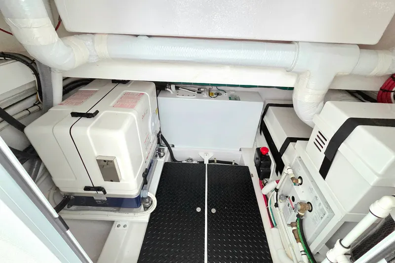 Slide: The Image of Engine room of 2025 Valhalla Boatworks V-46, featuring advanced equipment and piping. - 33