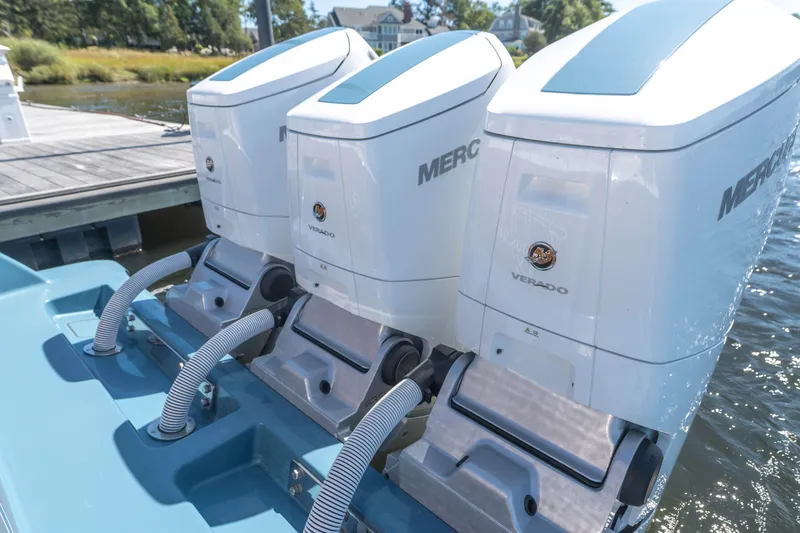 Slide: The Image of 2025 Valhalla Boatworks V-46 with triple Mercury Verado outboard engines at dock. - 6