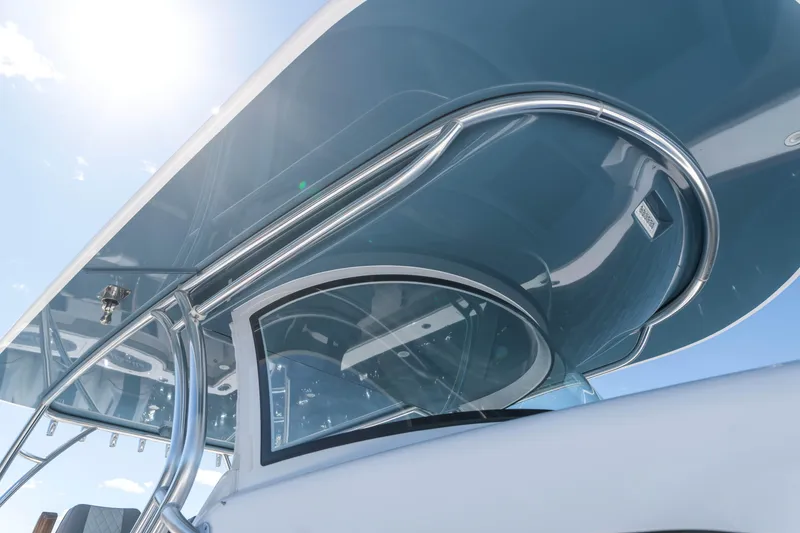 Slide: The Image of 2025 Valhalla Boatworks V-46, sleek design, polished metal, under clear blue sky. - 7