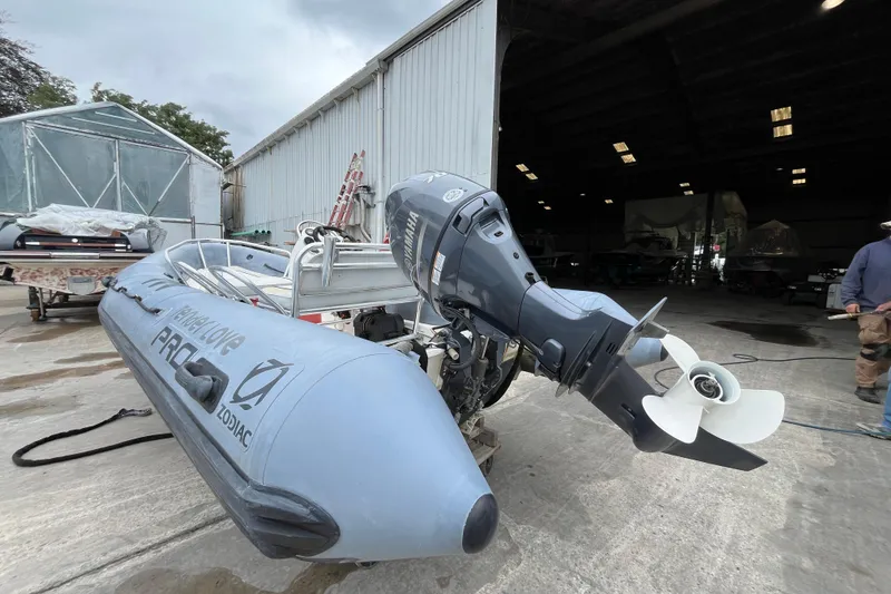 The Image of 2019 Zodiac Open 4.8 boat with Yamaha outboard motor in a boatyard setting. - 1