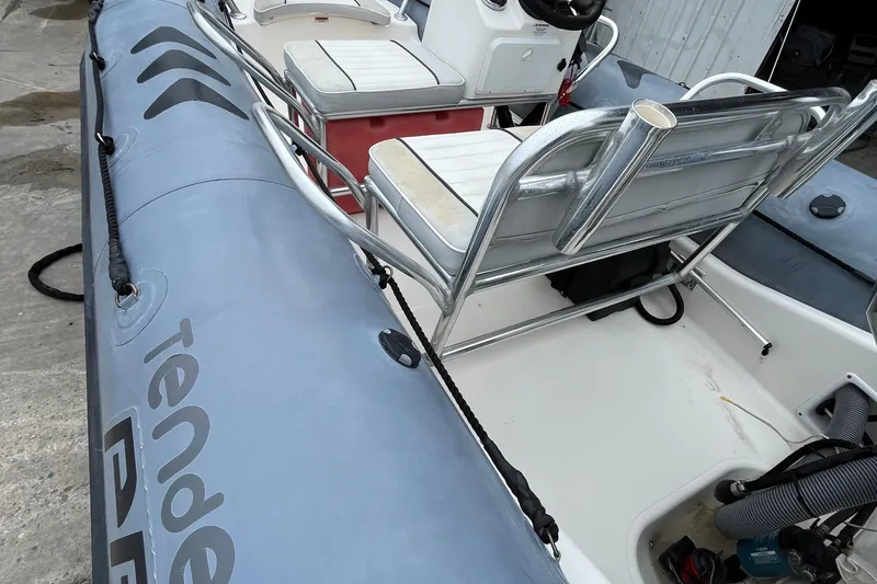 Slide: The Image of 2019 Zodiac Open 4.8 inflatable boat interior with seating and steering console. - 10