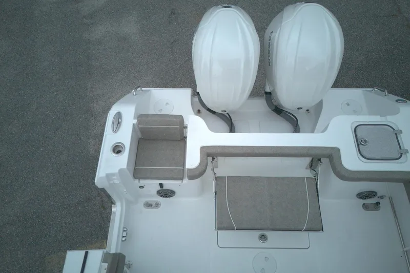 Slide: The Image of 2026 Sea Hunt Gamefish 28 boat with dual engines and seating, viewed from above. - 1