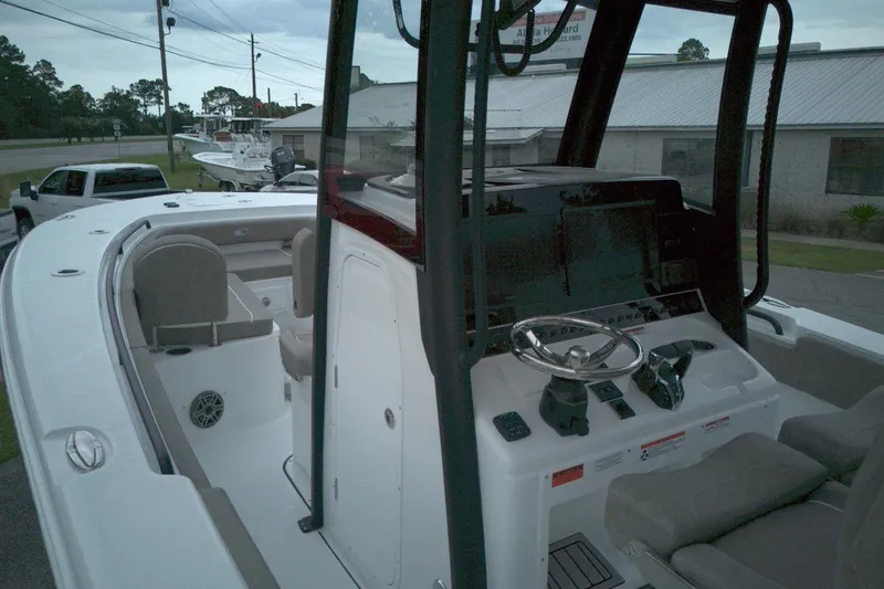 Slide: The Image of 2026 Sea Hunt Gamefish 28 Forward Seating boat interior with steering console and seating. - 12