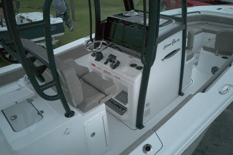 Slide: The Image of 2026 Sea Hunt Gamefish 28 Forward Seating boat interior with helm and seating area. - 14