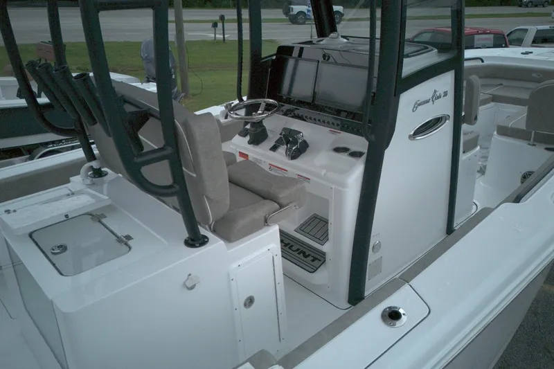 Slide: The Image of 2026 Sea Hunt Gamefish 28 Forward Seating boat interior with helm and seating area. - 15