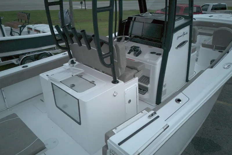 Slide: The Image of 2026 Sea Hunt Gamefish 28 Forward Seating boat interior with helm and seating area. - 7