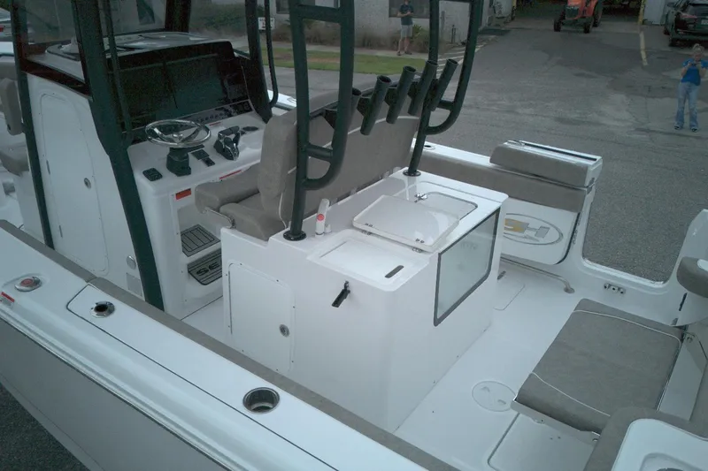 Slide: The Image of 2026 Sea Hunt Gamefish 28 Forward Seating boat interior with helm and seating area. - 8