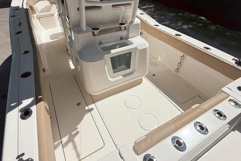 Slide: The Image of 2019 Pioneer 266 Pelagic boat interior with seating and storage compartments. - 12