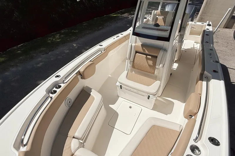 Slide: The Image of 2019 Pioneer 266 Pelagic boat interior with beige seating and modern design. - 18