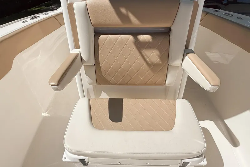 Slide: The Image of Luxurious seating on 2019 Pioneer 266 Pelagic boat with beige and white upholstery. - 19