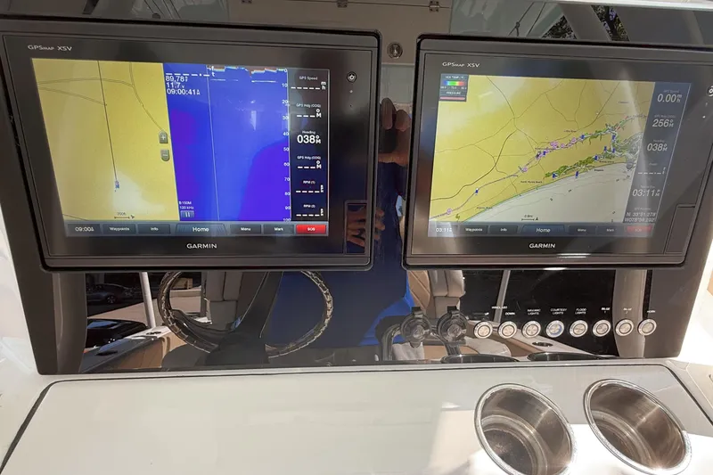 Slide: The Image of Dual Garmin displays on 2019 Pioneer 266 Pelagic boat dashboard. - 28