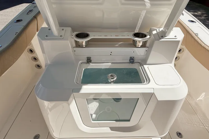 Slide: The Image of 2019 Pioneer 266 Pelagic boat interior with livewell and rod holders. - 33
