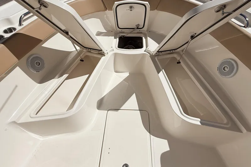 Slide: The Image of 2019 Pioneer 266 Pelagic boat interior with open storage compartments and speakers. - 34