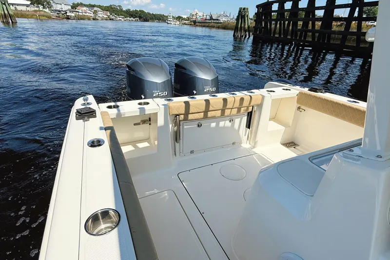 Slide: The Image of 2019 Pioneer 266 Pelagic boat with dual Yamaha 250 engines on a calm river. - 46
