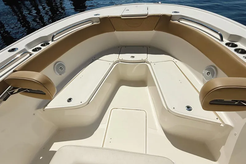 Slide: The Image of 2019 Pioneer 266 Pelagic boat interior with tan seating and stainless steel accents. - 47