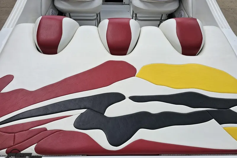 Slide: The Image of 2002 Baja 25 Outlaw boat interior with colorful abstract upholstery design. - 41