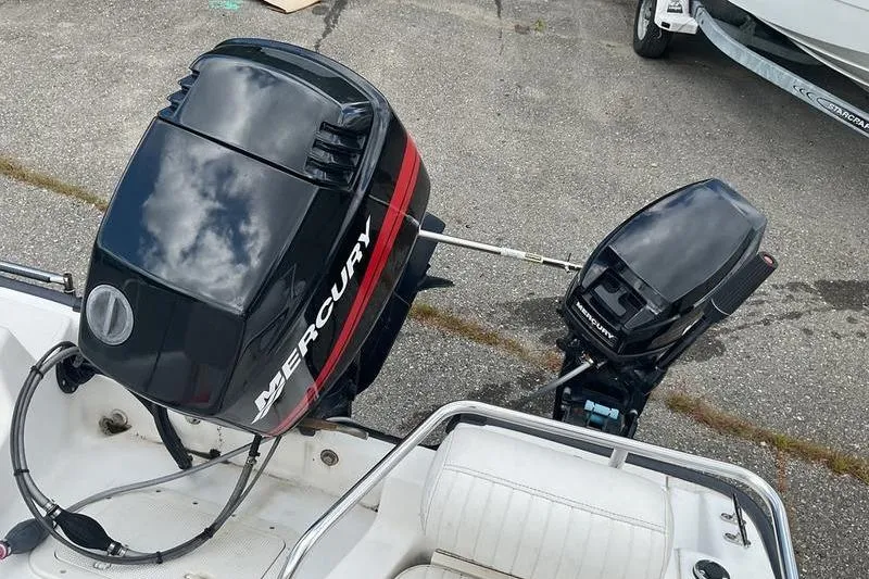 Slide: The Image of Boston Whaler 160 Dauntless 2000 with Mercury outboard motors on display. - 5