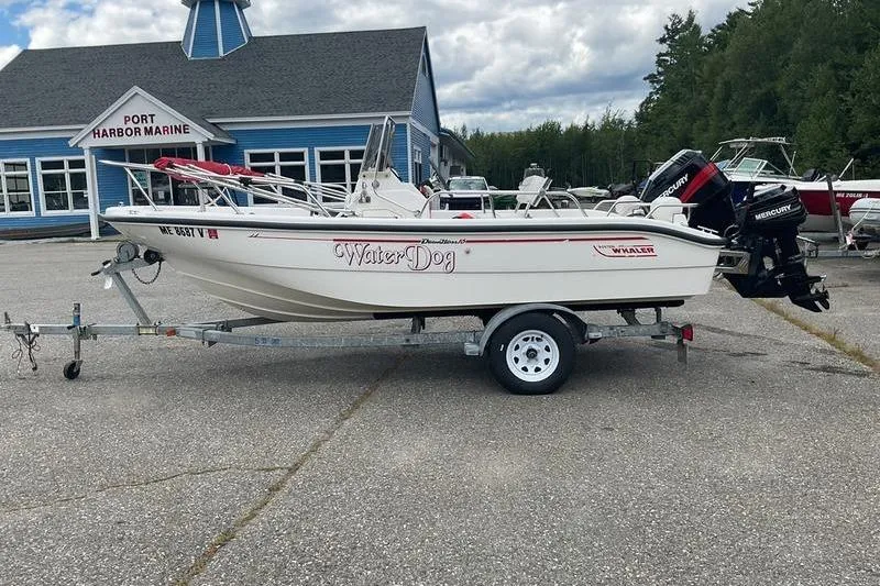 Slide: The Image of 2000 Boston Whaler 160 Dauntless boat on trailer at Port Harbor Marine. - 6