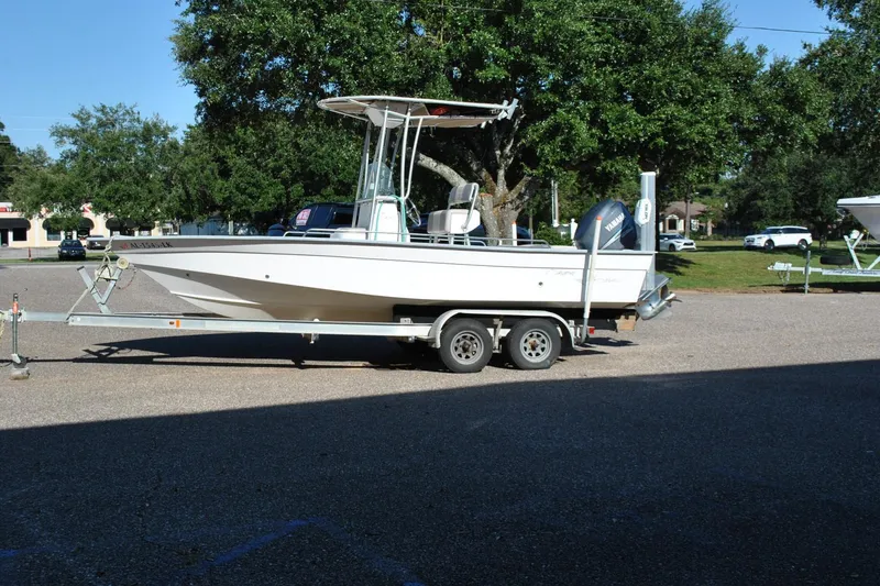 The Image of 2005 Cape Horn 22 Bay boat on trailer, parked outdoors with trees in background. - 1