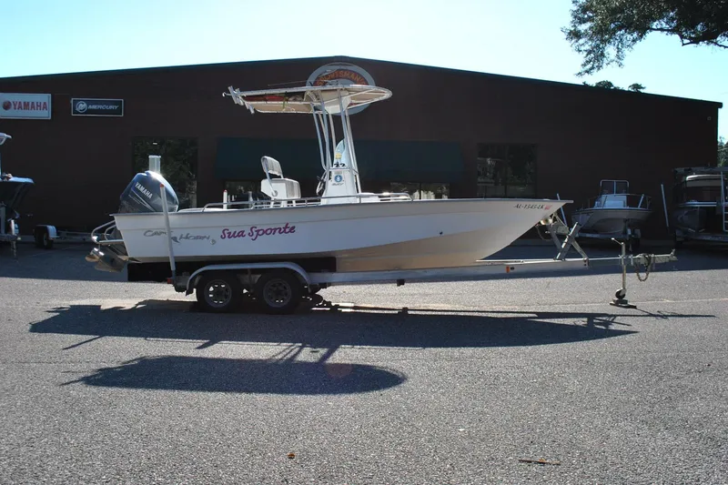 Slide: The Image of 2005 Cape Horn 22 Bay boat on trailer, parked outside dealership. - 6