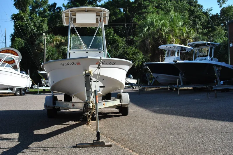 Slide: The Image of 2005 Cape Horn 22 Bay boat on trailer, parked outdoors with trees in background. - 3