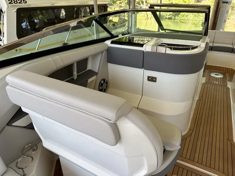 Slide: The Image of 2023 Sea Ray SLX 310 OB boat interior with luxurious seating and modern design. - 5