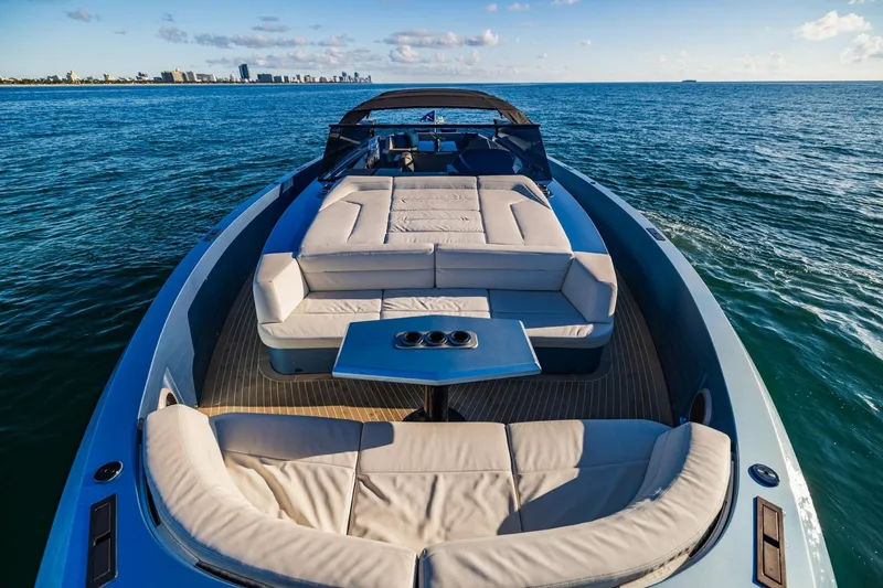 Slide: The Image of Luxurious 2019 Vanquish Yachts VQ58 cruising on open sea with elegant seating. - 10