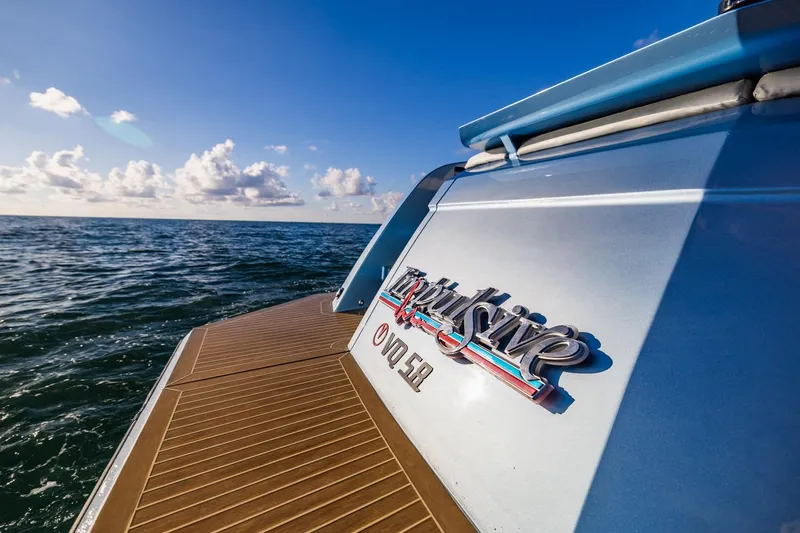 Slide: The Image of 2019 Vanquish Yachts VQ58 on open sea, showcasing sleek design and luxury features. - 14