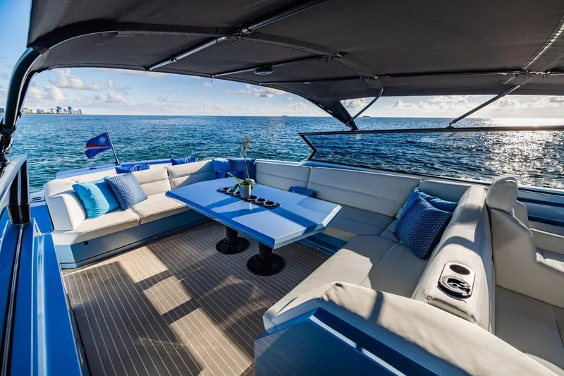 Slide: The Image of Luxurious 2019 Vanquish Yachts VQ58 with elegant seating and ocean view. - 16