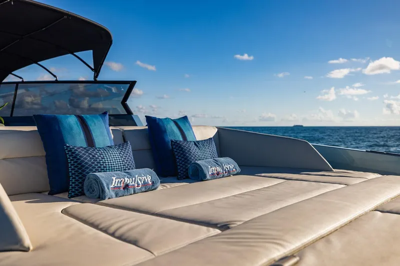 Slide: The Image of Luxurious 2019 Vanquish Yachts VQ58 deck with plush seating and ocean view. - 18