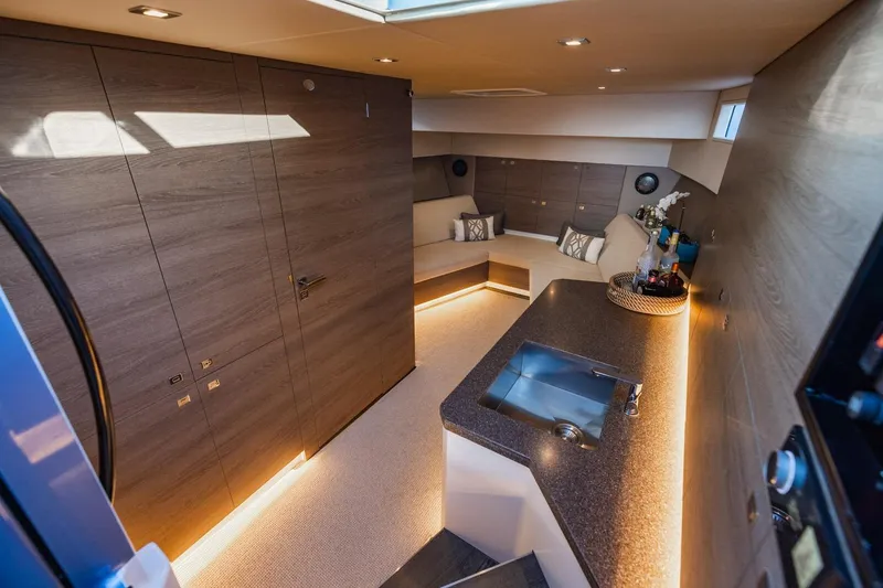 Slide: The Image of Luxurious interior of 2019 Vanquish Yachts VQ58 with modern design and ambient lighting. - 19