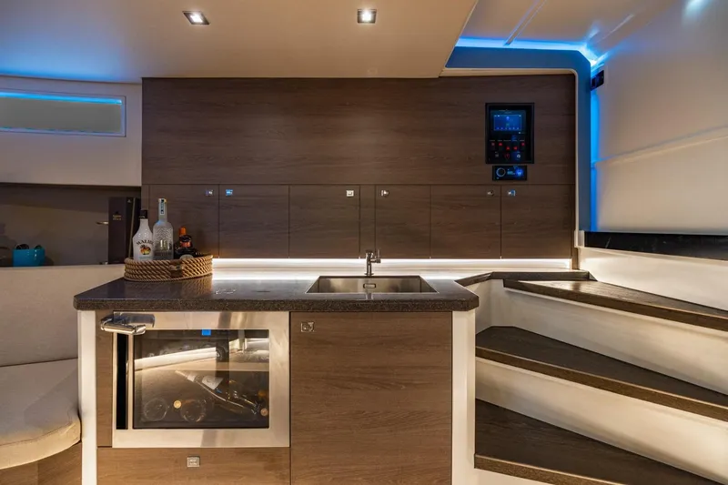 Slide: The Image of Luxurious 2019 Vanquish Yachts VQ58 interior with modern kitchen and ambient lighting. - 21