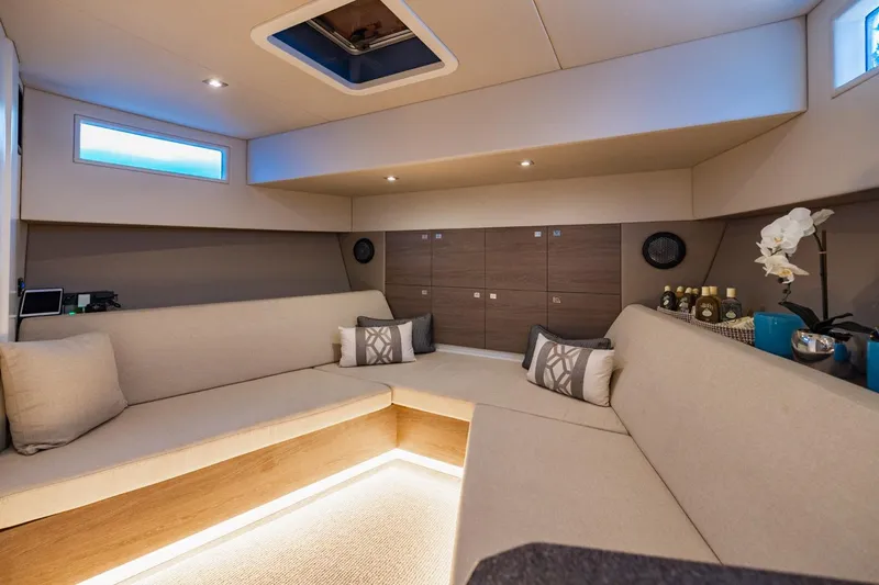 Slide: The Image of Luxurious interior of 2019 Vanquish Yachts VQ58 with modern seating and elegant decor. - 22