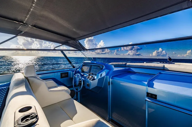 Slide: The Image of Luxurious 2019 Vanquish Yachts VQ58 interior with ocean view and modern helm. - 23
