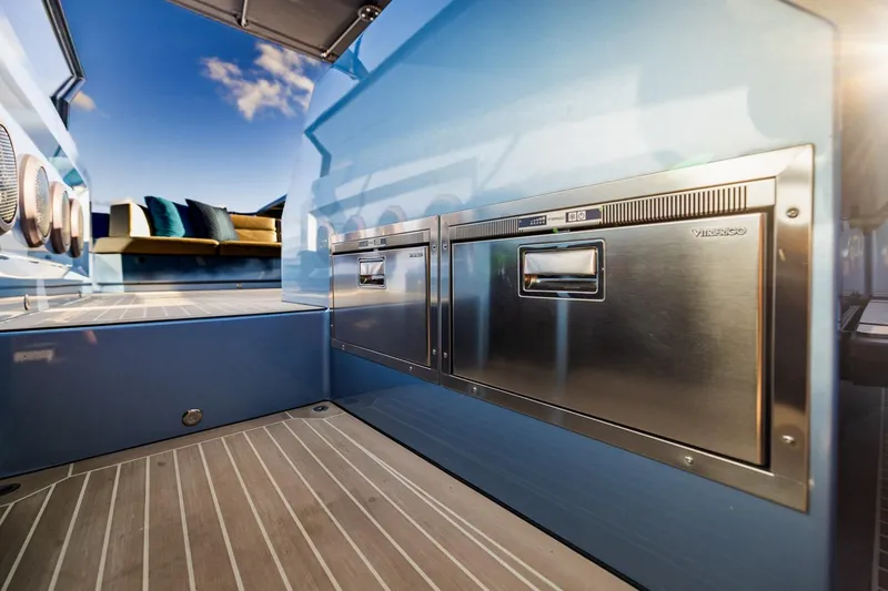 Slide: The Image of Luxurious 2019 Vanquish Yachts VQ58 interior with sleek stainless steel appliances and modern design. - 25