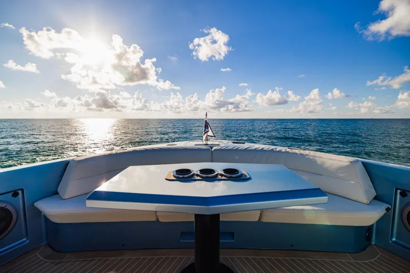 Slide: The Image of Luxurious 2019 Vanquish Yachts VQ58 with ocean view and elegant seating area. - 28