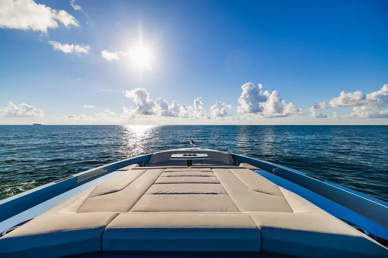 Slide: The Image of Luxurious 2019 Vanquish Yachts VQ58 cruising on open sea under clear blue sky. - 29