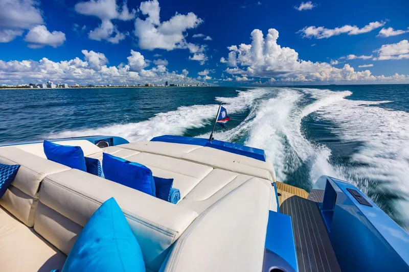 Slide: The Image of Luxurious 2019 Vanquish Yachts VQ58 cruising on open sea with blue sky and clouds. - 35