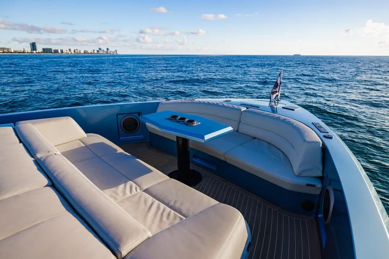 Slide: The Image of Luxurious 2019 Vanquish Yachts VQ58 with elegant seating, cruising on open ocean waters. - 5