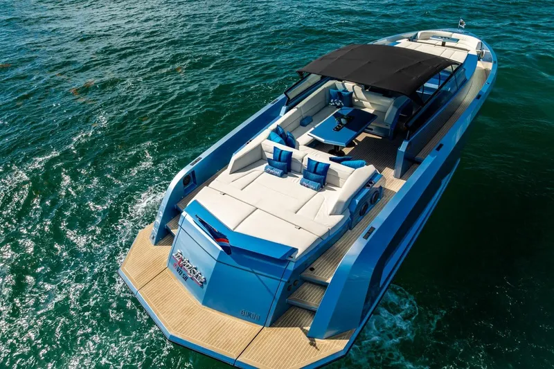 Slide: The Image of 2019 Vanquish Yachts VQ58 luxury yacht cruising on open water, featuring sleek design and spacious deck. - 6