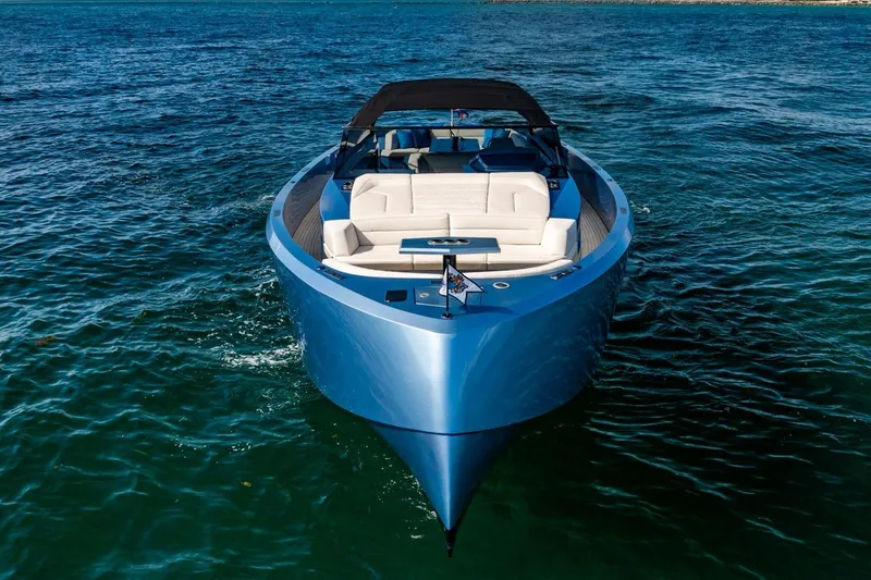 Slide: The Image of 2019 Vanquish Yachts VQ58 luxury yacht on open water, featuring sleek design and spacious seating. - 7