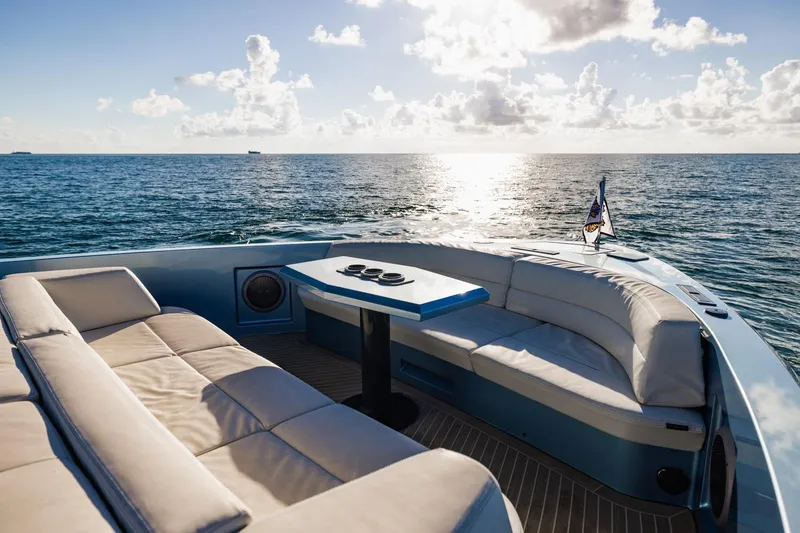 Slide: The Image of Luxurious 2019 Vanquish Yachts VQ58 with elegant seating, ocean view, and sunny sky. - 9