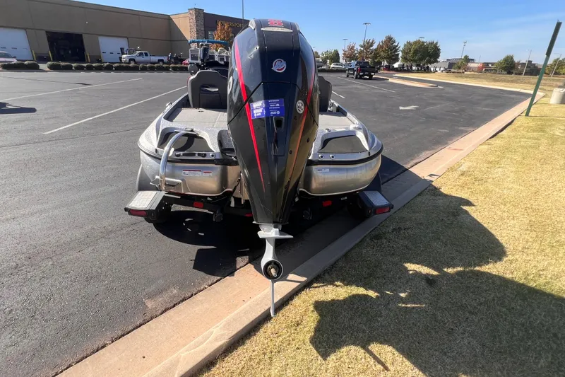 Slide: The Image of 2019 Nitro Z19 Pro boat parked on asphalt near a grassy area. - 5