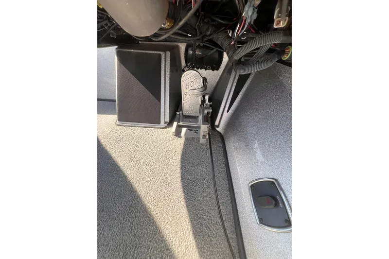 Slide: The Image of Foot pedal assembly in a 2019 Nitro Z19 Pro boat interior. - 9