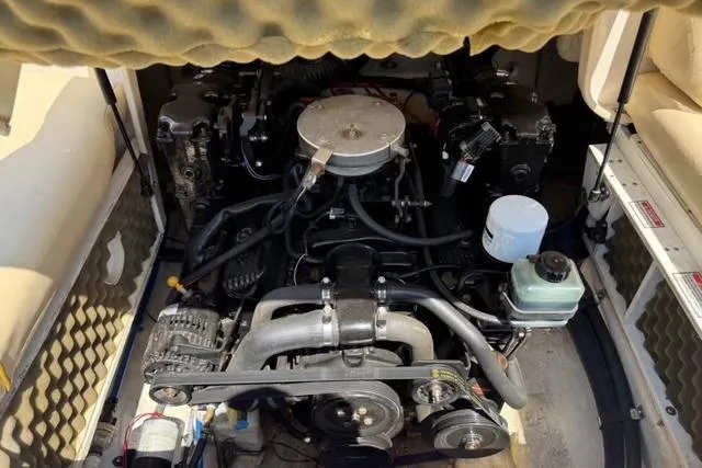 Slide: The Image of Engine compartment of a 2002 Sea Ray 210 Sundeck boat, showing detailed components. - 11