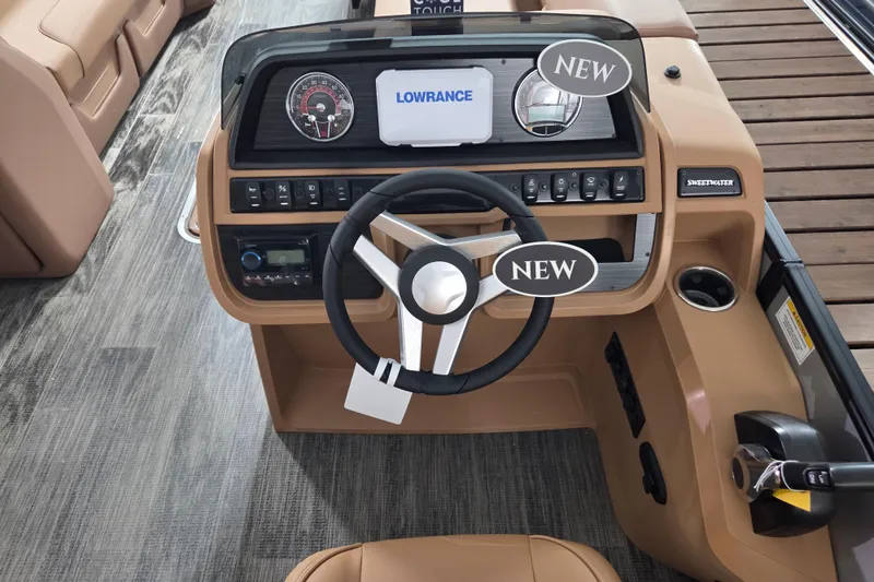 Slide: The Image of 2026 Godfrey SWEETWATER 2486 SFL boat dashboard with steering wheel and control panel. - 7