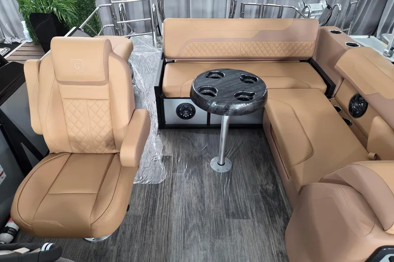 Slide: The Image of Luxurious interior of 2026 Godfrey SWEETWATER 2486 SFL pontoon boat with tan seating and table. - 9