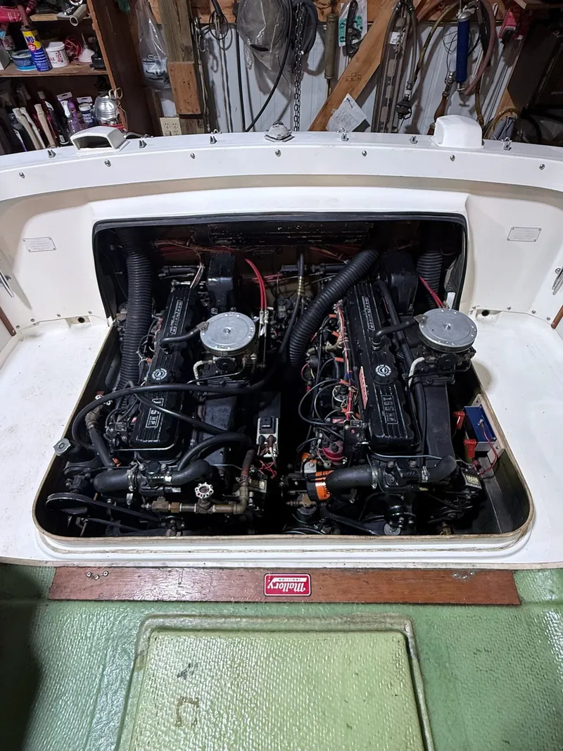 Slide: The Image of Twin engines in a 1973 Bertram Sport Fisherman boat, detailed view in a workshop. - 6